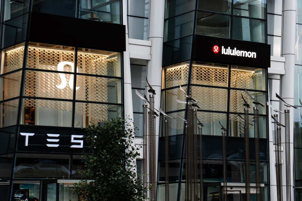 Illuminated lululemon logo and Prudential Center window bays framed by the custom printed mesh installation in Boston.