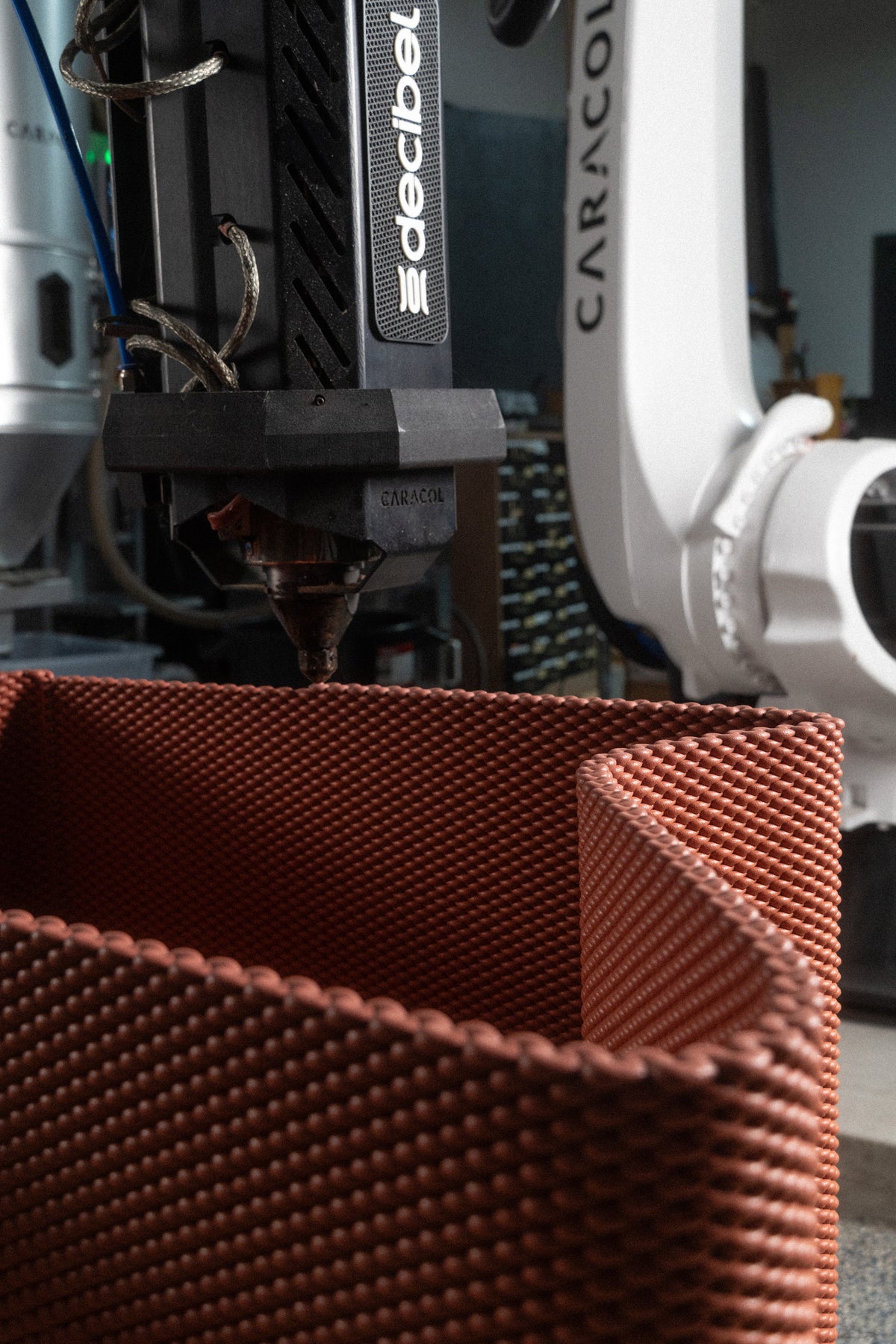 Robotic printing of the red patterned bench structure for lululemon’s SoHo flagship.